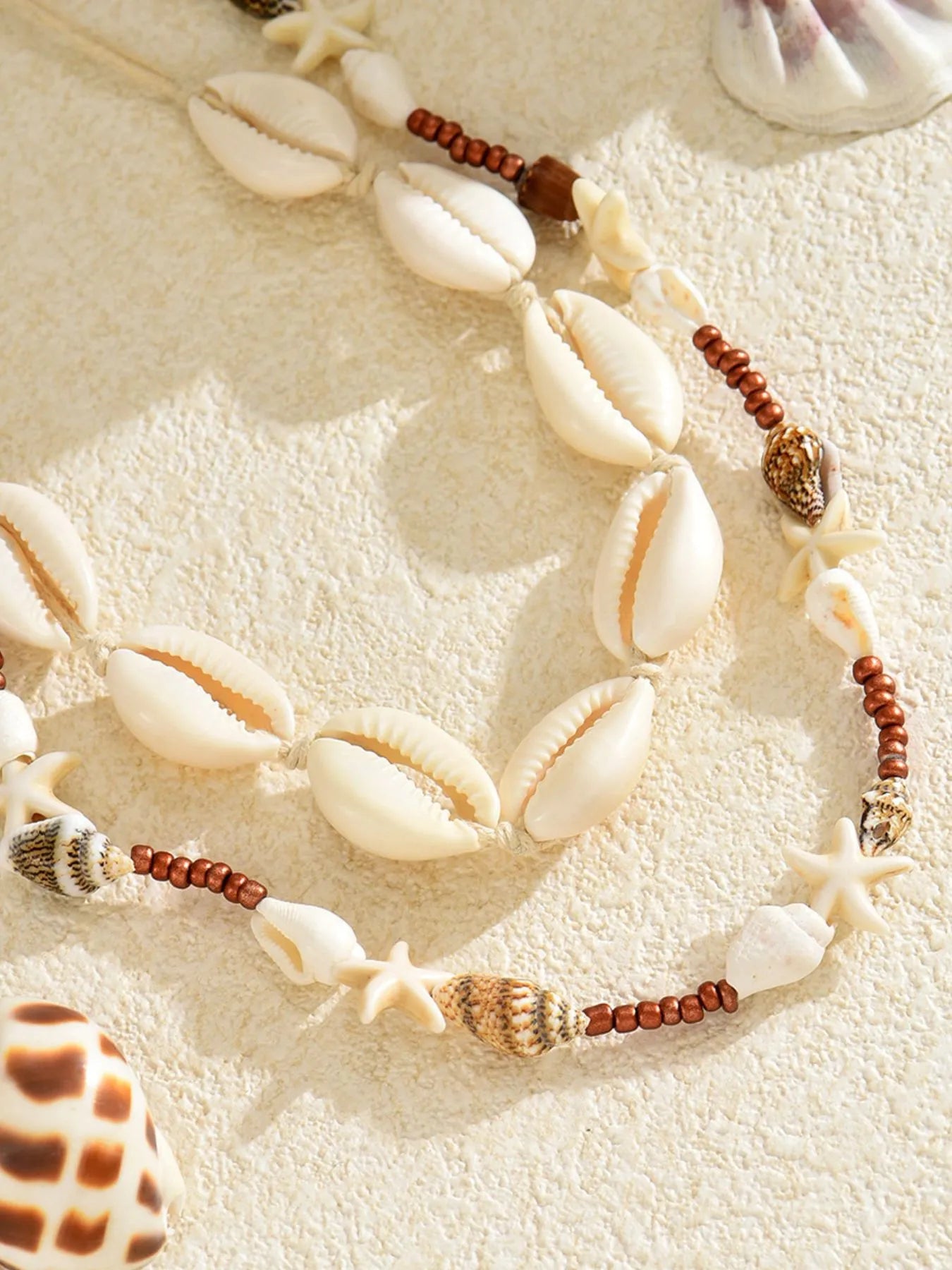Shell charm necklace set with cowrie shells, starfish charms, copper bead chain