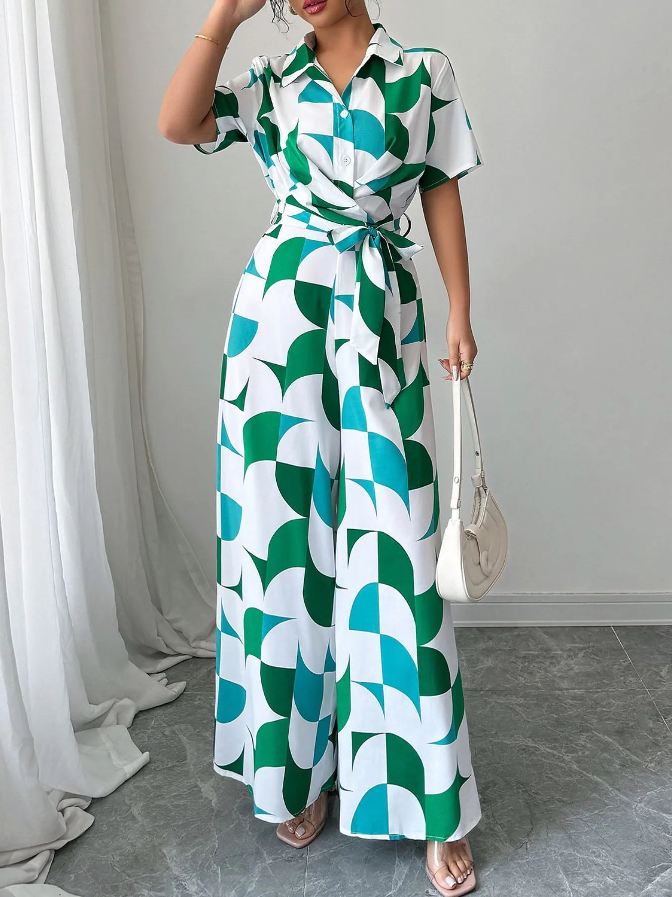Green and turquoise geometric belted wide-leg jumpsuit, long flowy skirt, short sleeves