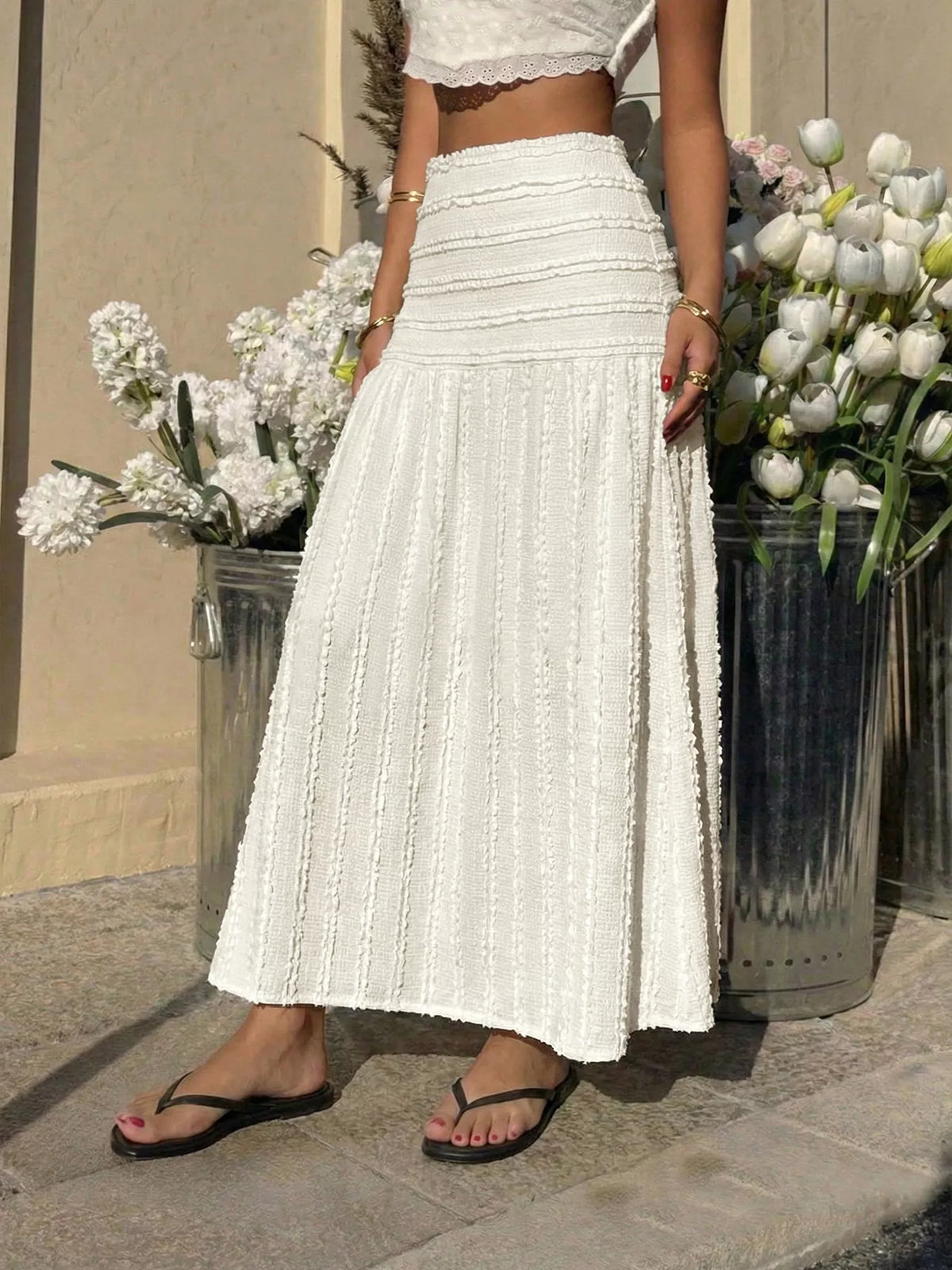 Ivory tiered midi skirt with vertical textured stripes and gathered ruffle waist