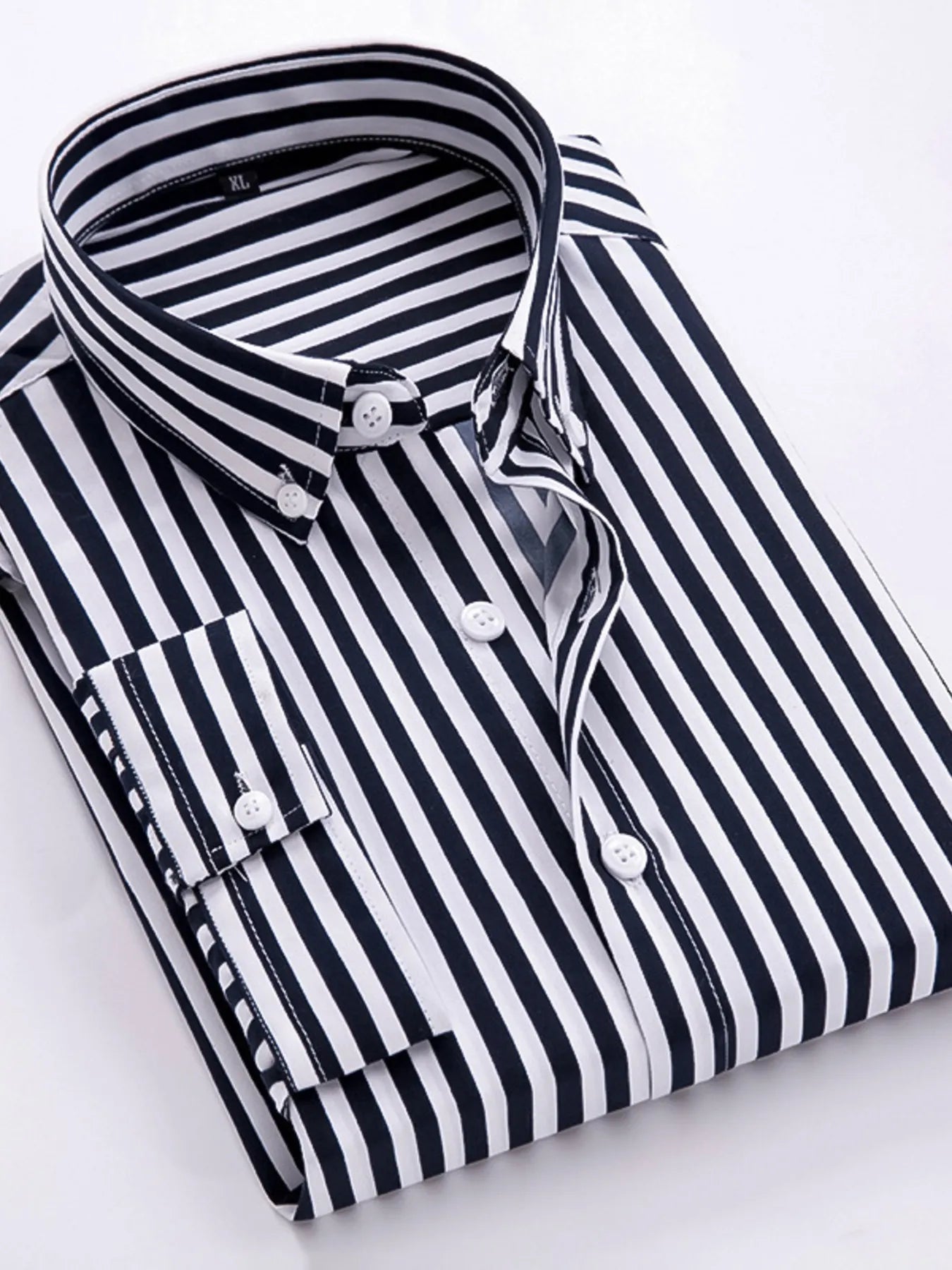Striped button-up long-sleeve shirt in black and white with white buttons, folded collar