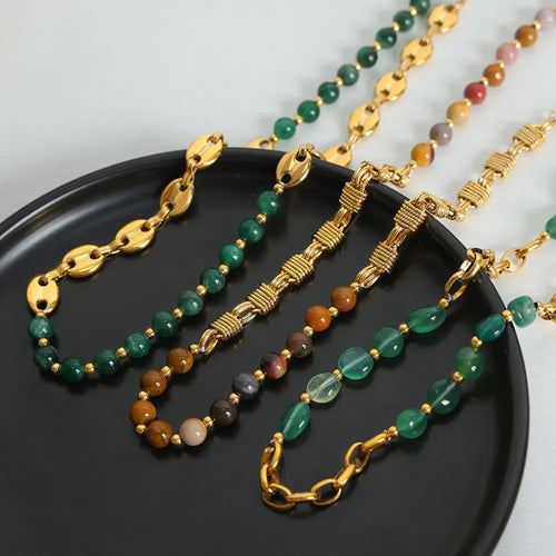 Beaded necklace stack with gold links and green round beads, clasp and short drops