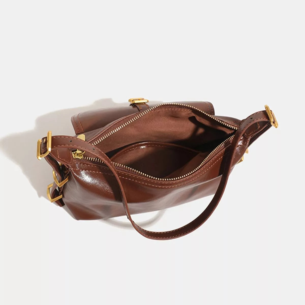Caramel vegan leather shoulder bag with open top, zipper opening, buckle flap, gold hardware