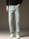 Light wash straight-leg jeans with five-pocket styling and zip fly