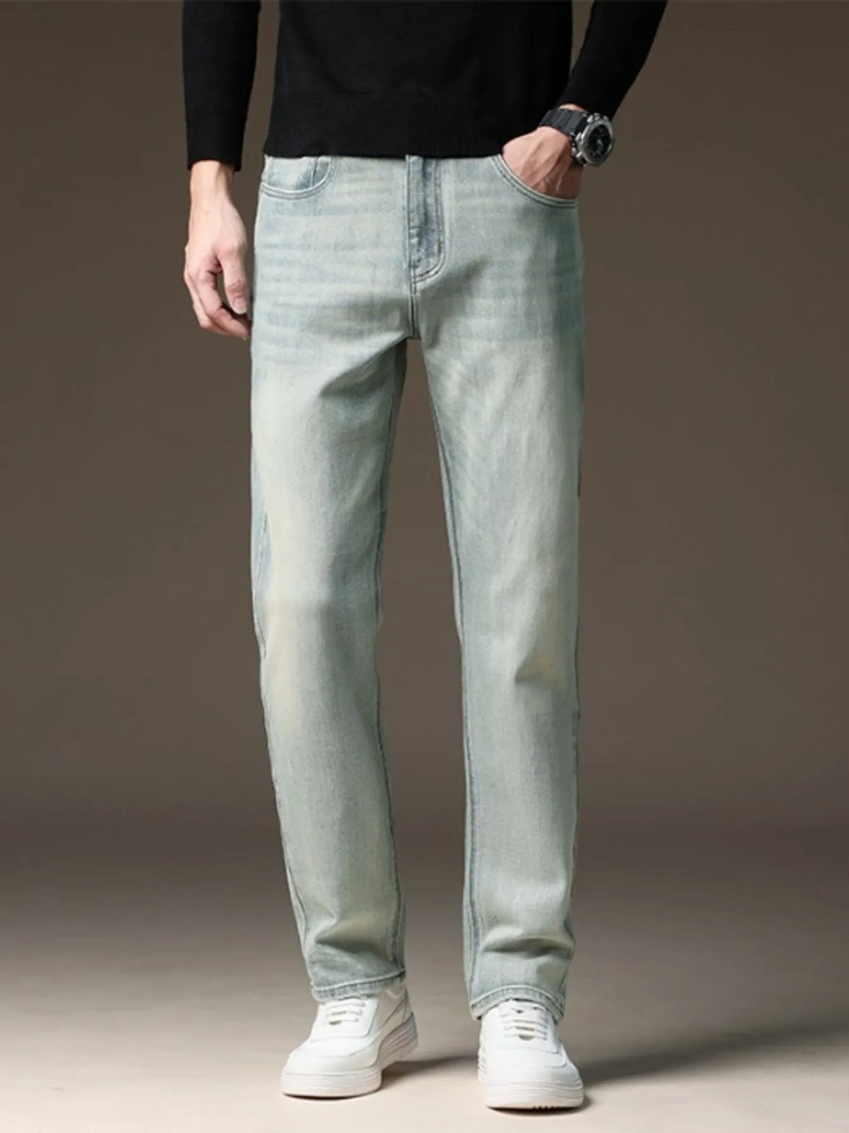 Light wash straight-leg jeans with five-pocket styling and zip fly