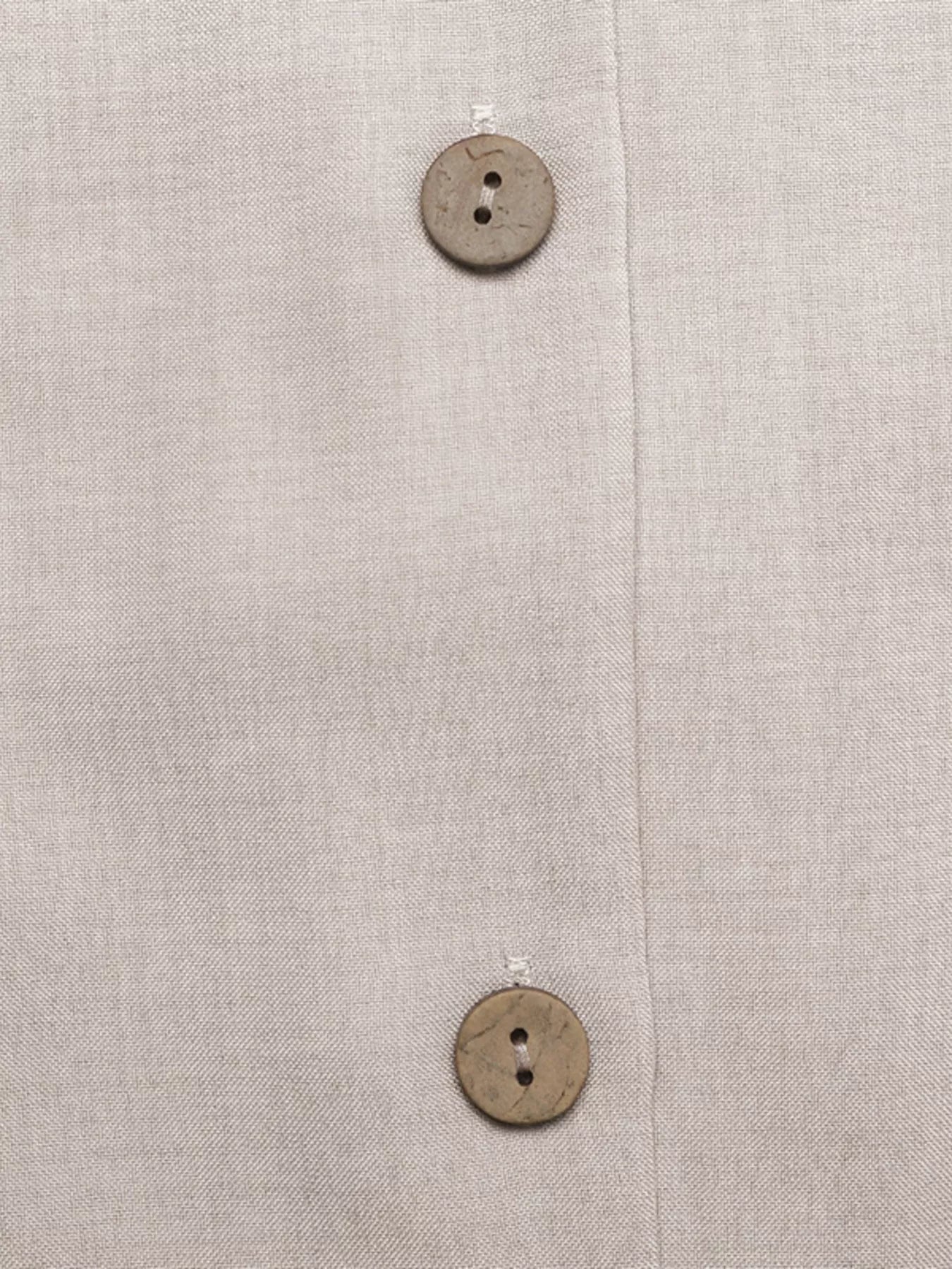 Cedar & Moore Sleeveless button-down midi dress in beige linen with visible wooden buttons.