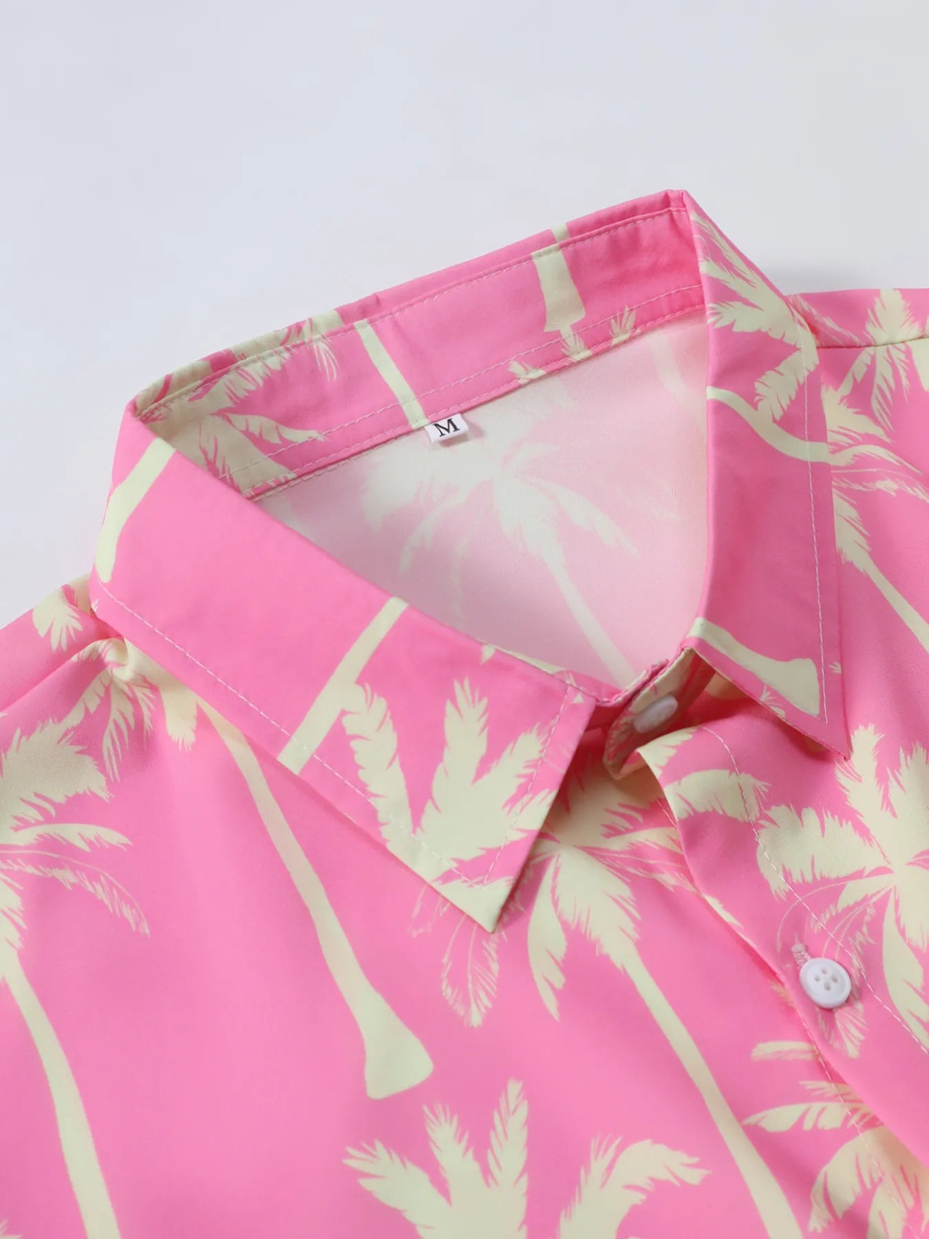Dusty pink palm print button-up shirt collar detail