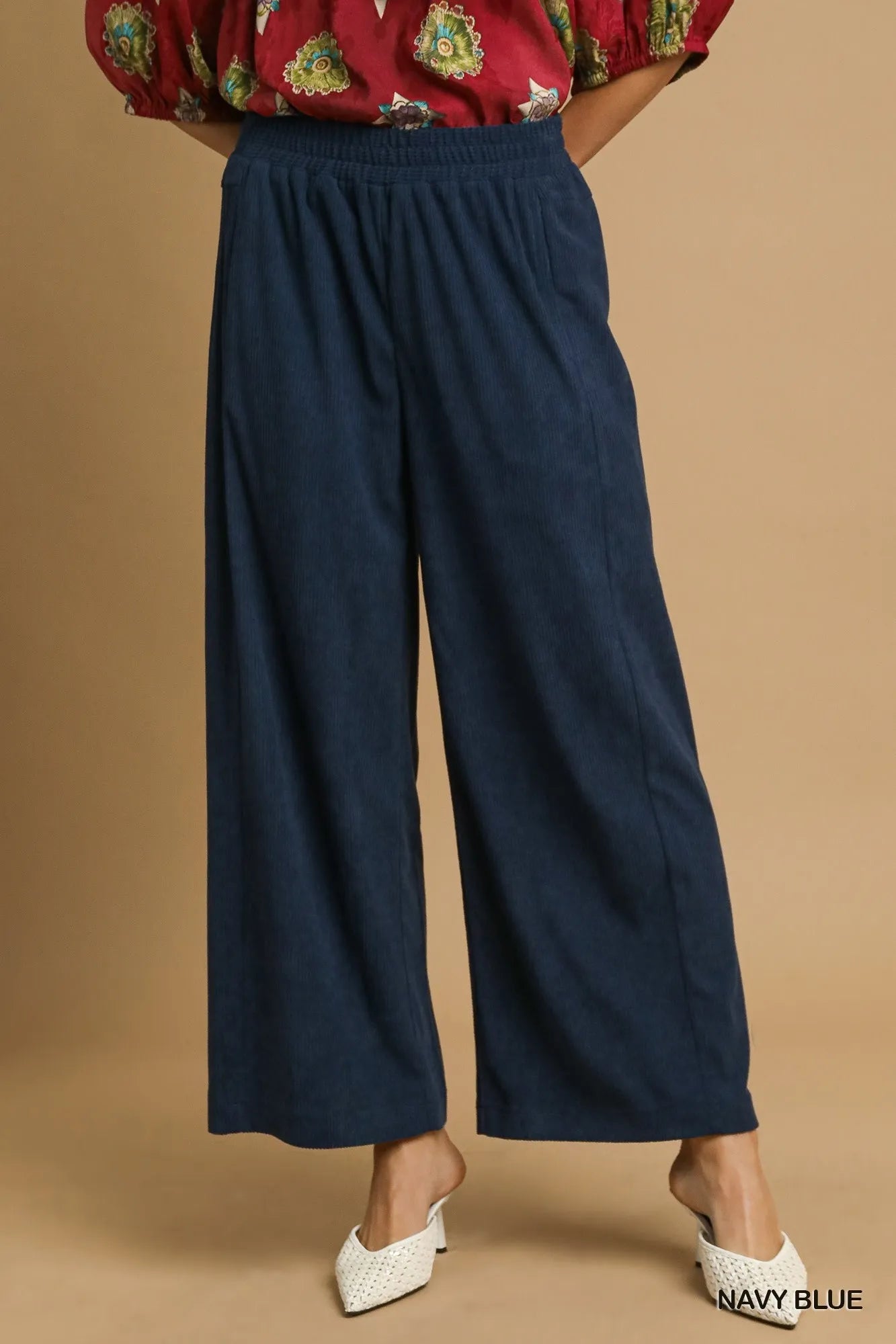 Navy blue corduroy wide-leg pants with elastic waistband and relaxed fit