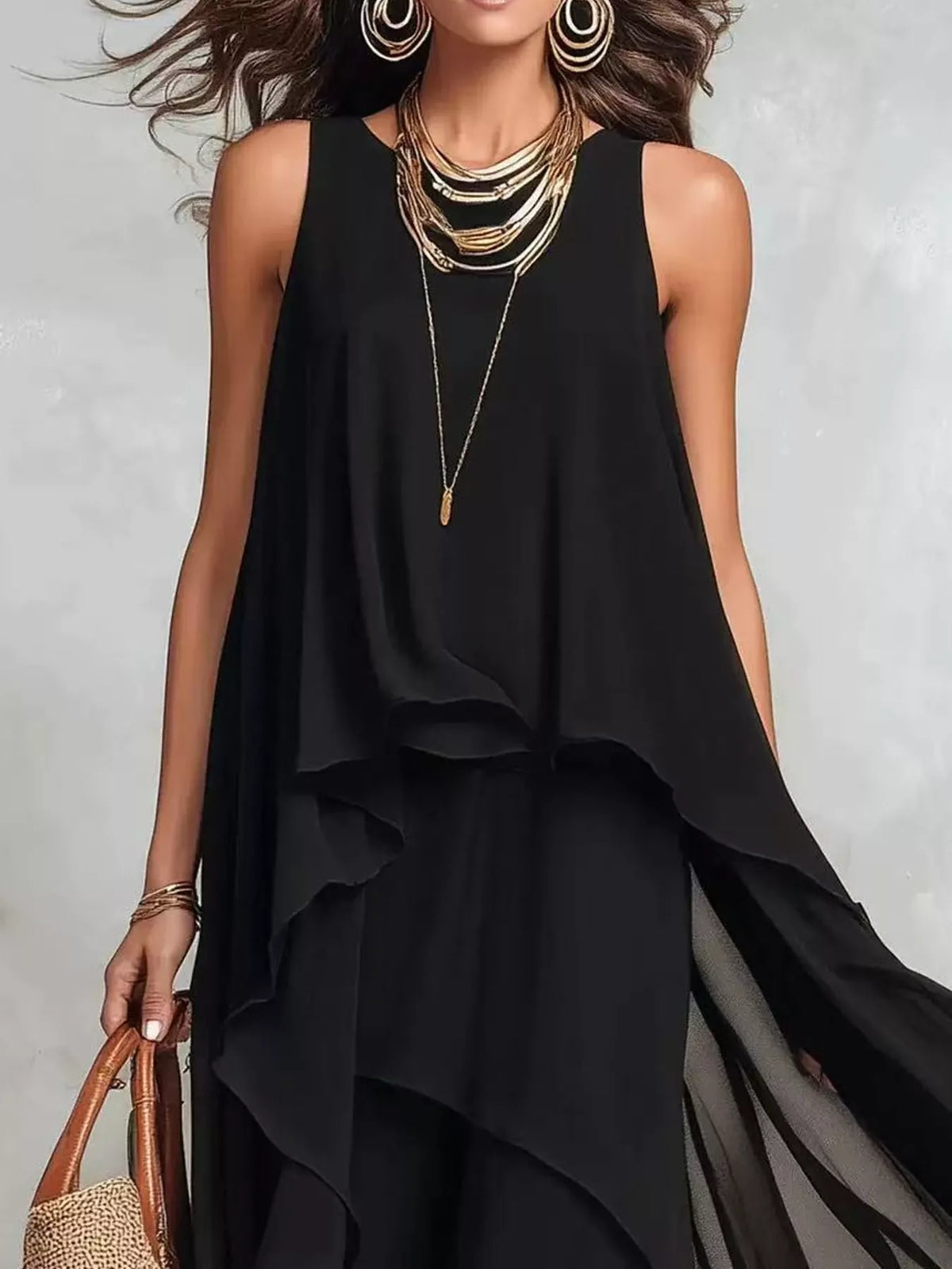 Black sleeveless maxi dress with draped ruffles and layered skirt