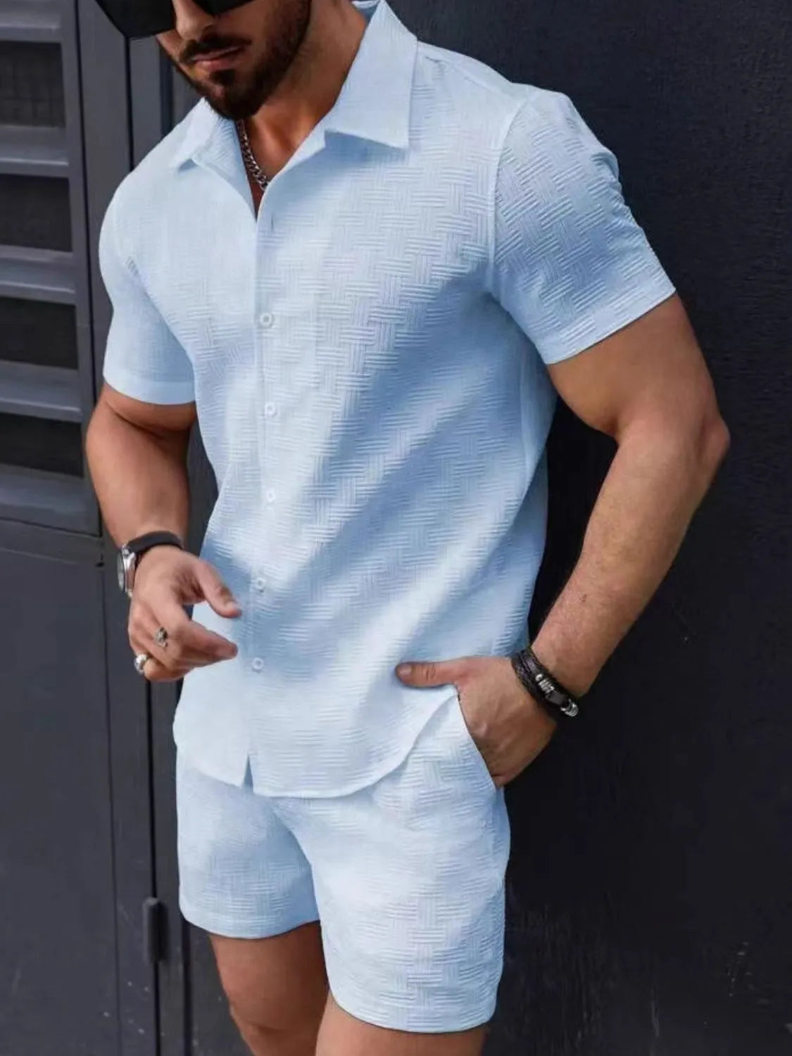 Light blue short-sleeve button-up shirt and matching shorts set with open collar