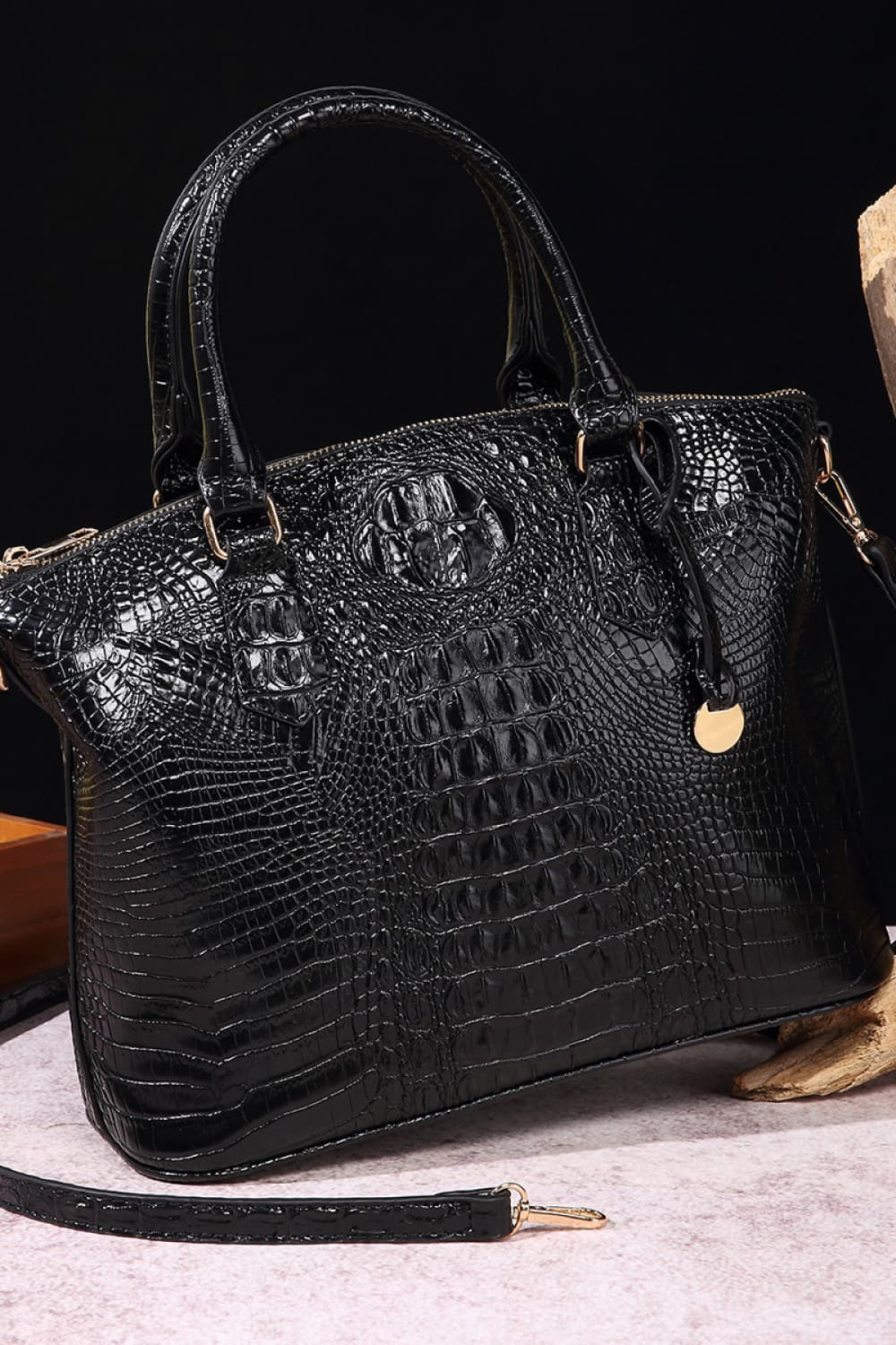 Black croc-embossed vegan leather handbag with top handles and gold-tone zipper detail