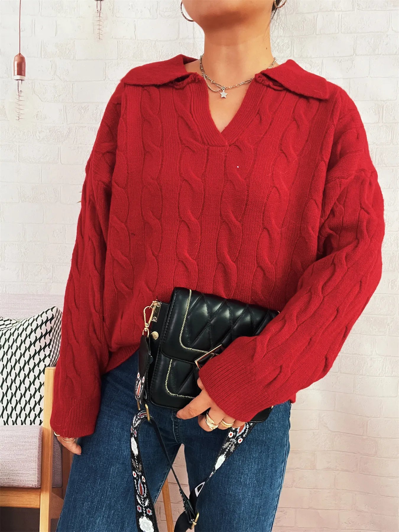 Red cable-knit Johnny collar sweater with V-neck and raised cable stitch texture