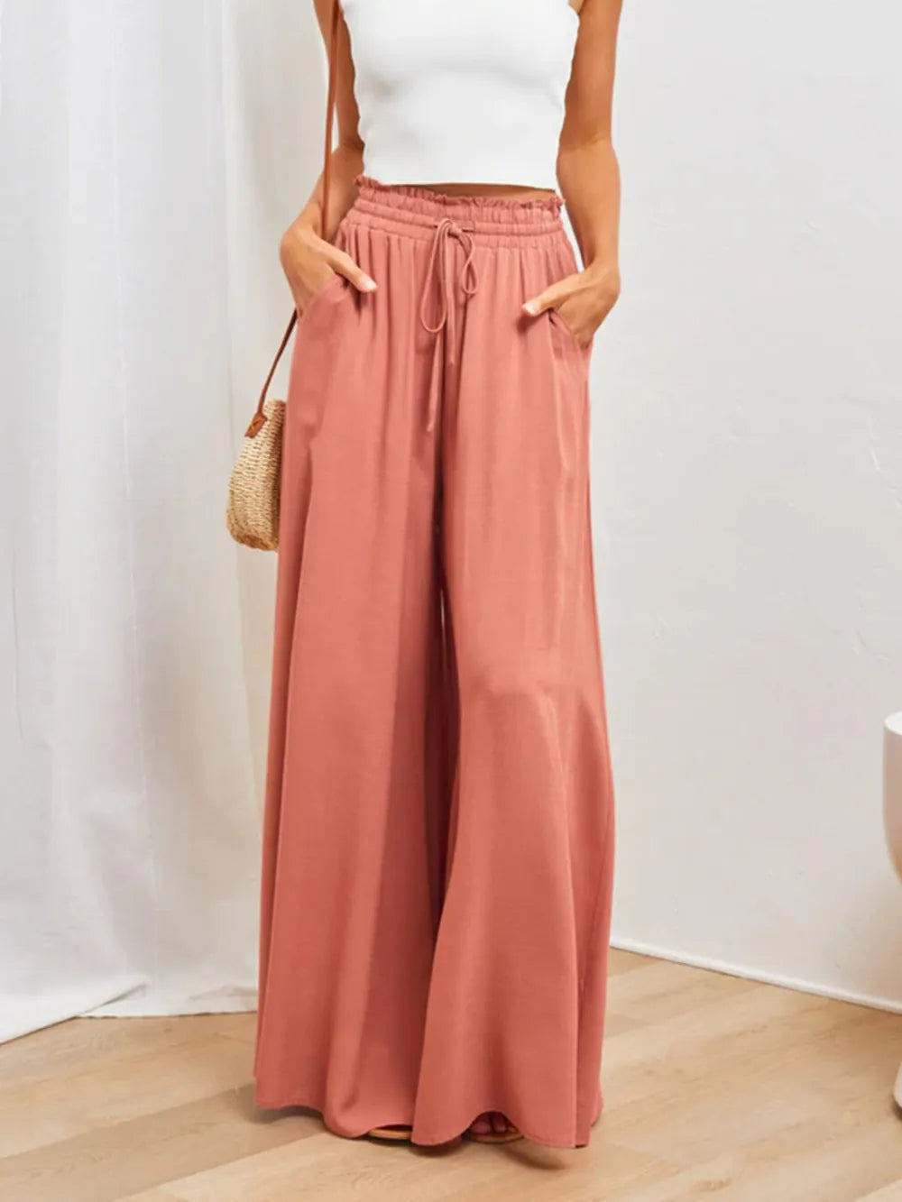 High-waist wide-leg pants in coral with gathered elastic waist and long wide legs