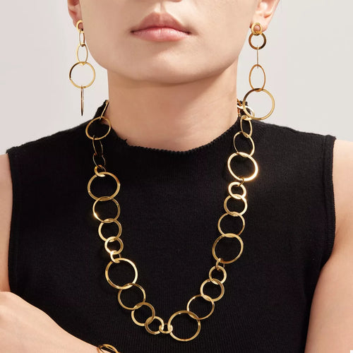 Gold-plated chain link statement necklace with long oval-link strand at collar