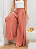 High-waist wide-leg pants in coral with elastic drawstring waist and flowing wide legs