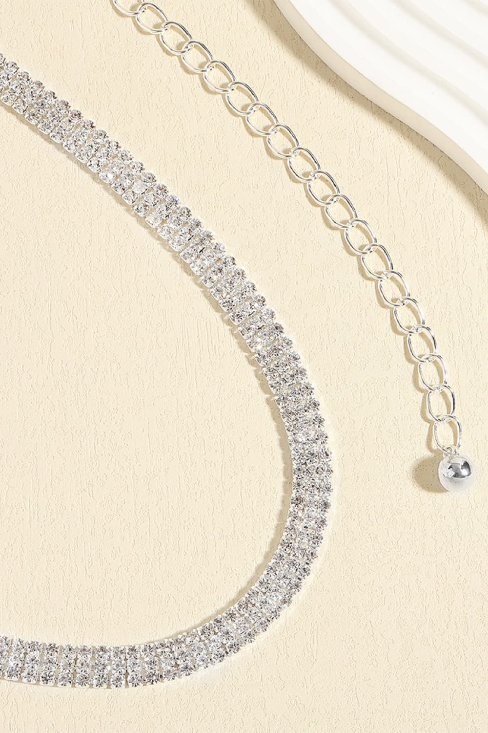Silver-toned rhinestone alloy belt with round chain links and clasp