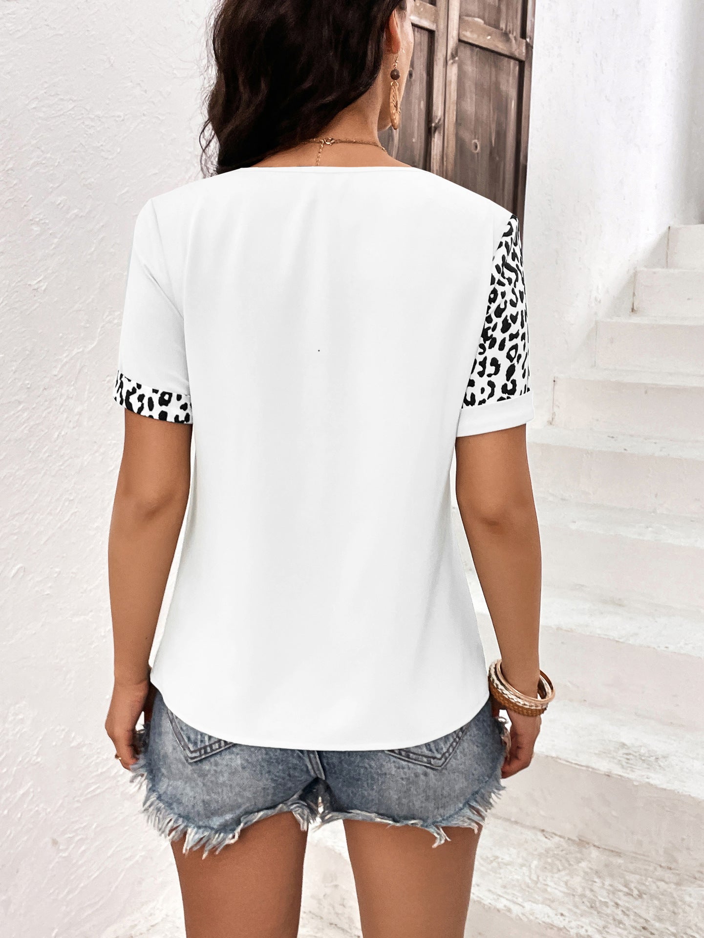 Cedar & Moore Ivy Lane Leopard Round Neck Short Sleeve Tee with white body and leopard-print sleeves