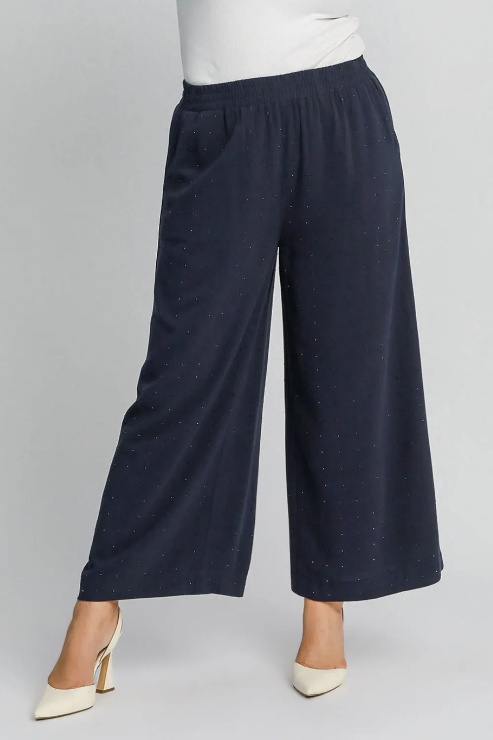 High-waisted dark blue wide-leg pants with elastic waistband, speckled finish
