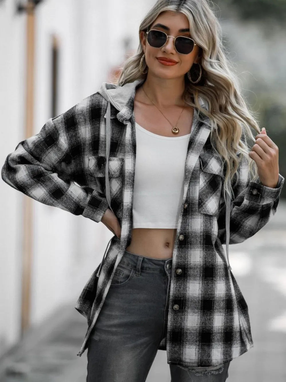 Gray plaid hooded shacket with drawstring hood, long sleeves and button placket