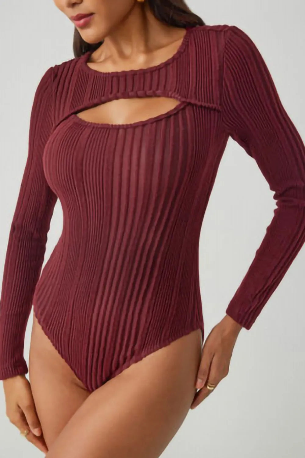 Deep red ribbed bodysuit with long sleeves and round neckline cutout