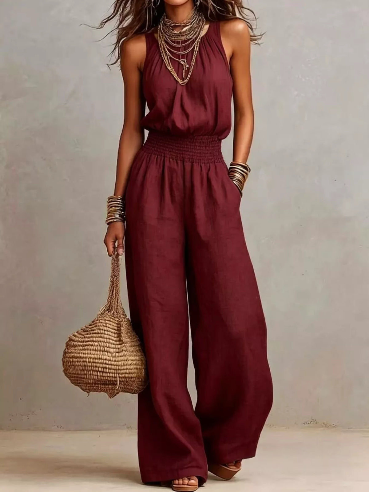 Pocketed halter neck wide-leg jumpsuit in burgundy, sleeveless halter with smocked waist