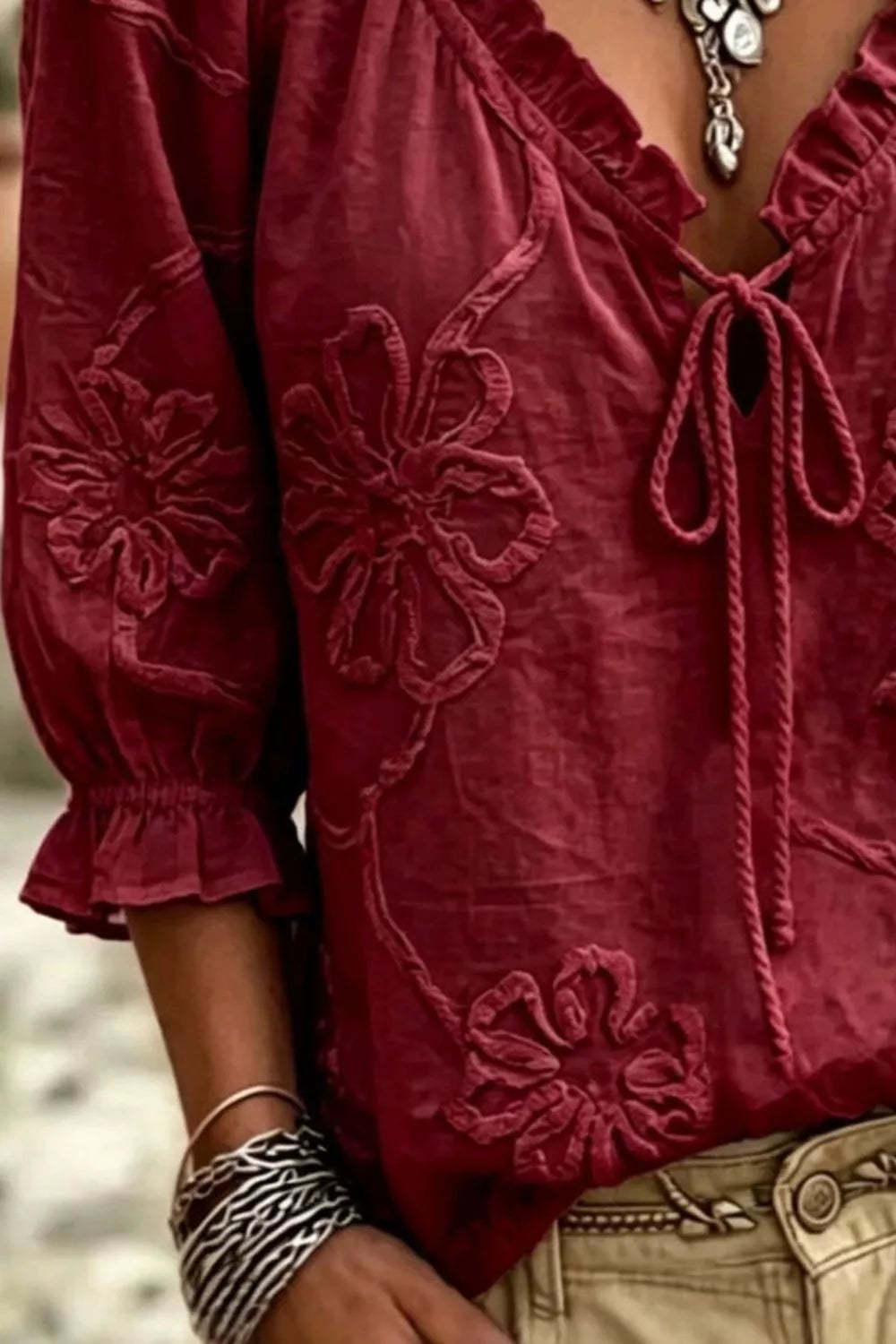 Burgundy floral embroidered blouse with tie-neck detail and 3/4 ruffled sleeves