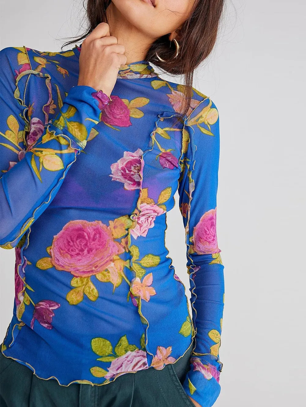 Mock neck floral long-sleeve top in royal blue with pink roses, yellow leaves, ruffled trim