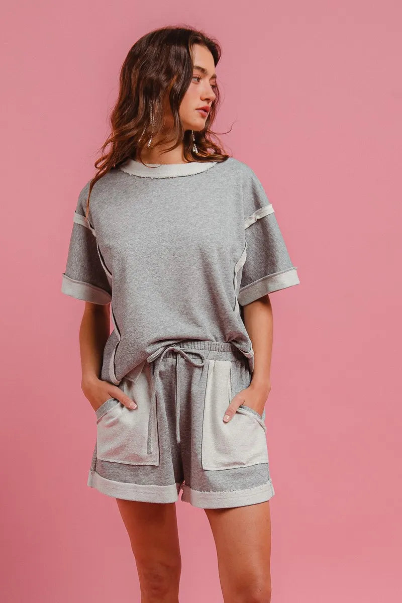 Heather grey French terry knit shorts with drawstring tie and side pocket openings