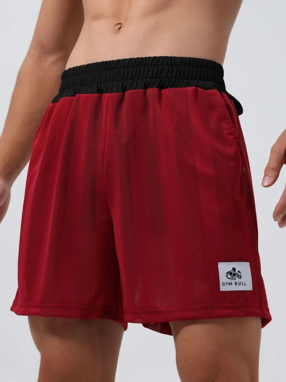 Deep red elastic waist mesh shorts with drawstring and GYM BULL logo patch