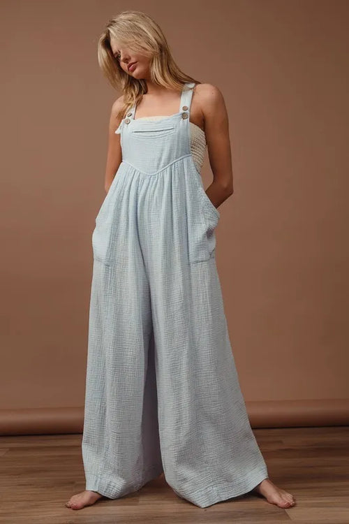 Light blue crinkle gauze wide-leg overalls with buttoned bib and adjustable straps