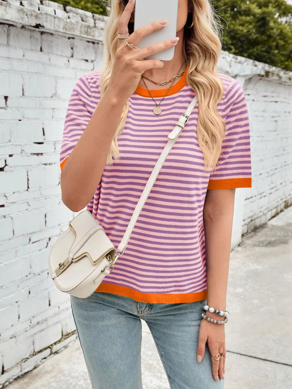 Lilac and white striped knit top with orange contrast round neck and half sleeves