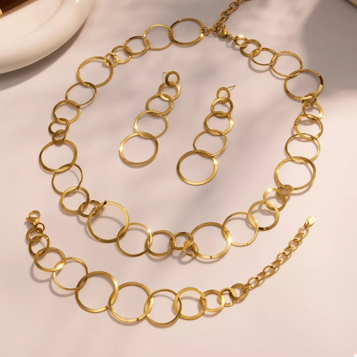 Gold-plated oval-link statement necklace with layered chain links and clasp