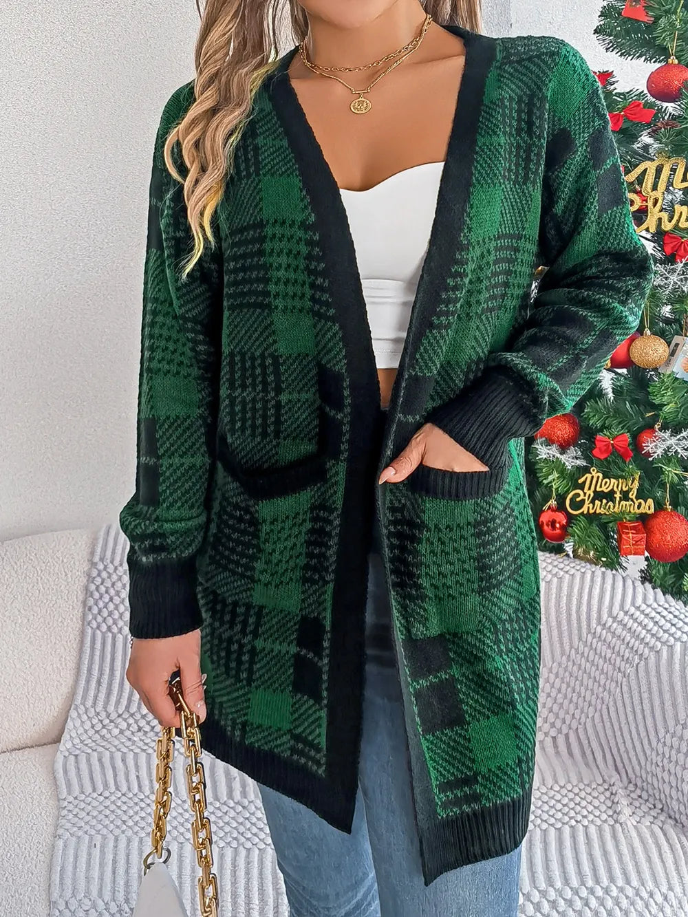 Dark green and black plaid open-front long sleeve cardigan with ribbed cuffs and hem