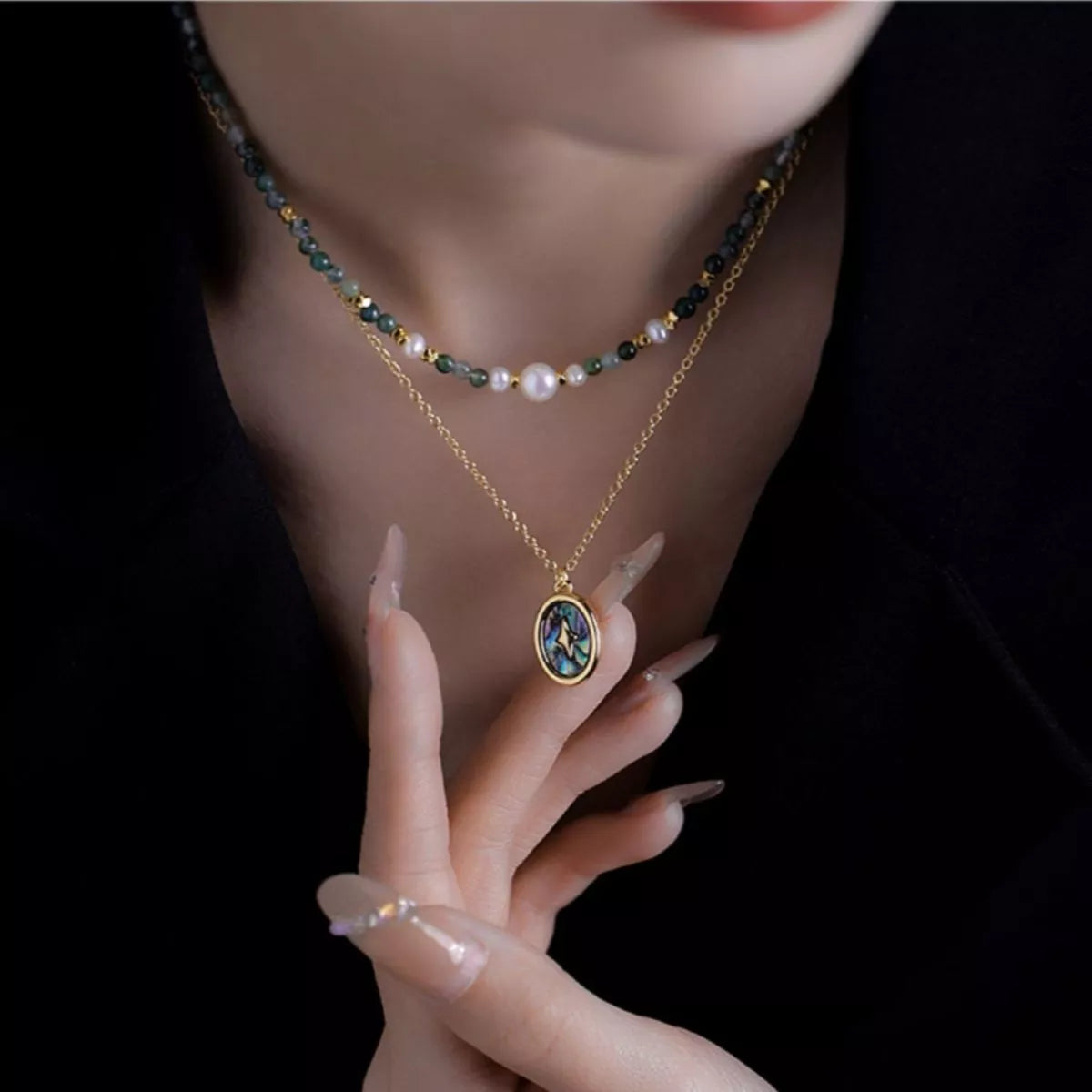Gold-plated oval pendant with blue inlay, paired with multicolor bead and pearl choker