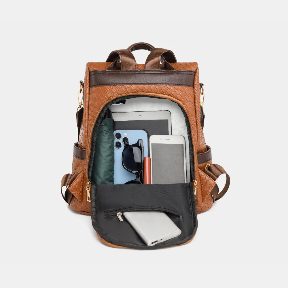 Vegan leather backpack bag in brown with dark front panel and zipper pocket.