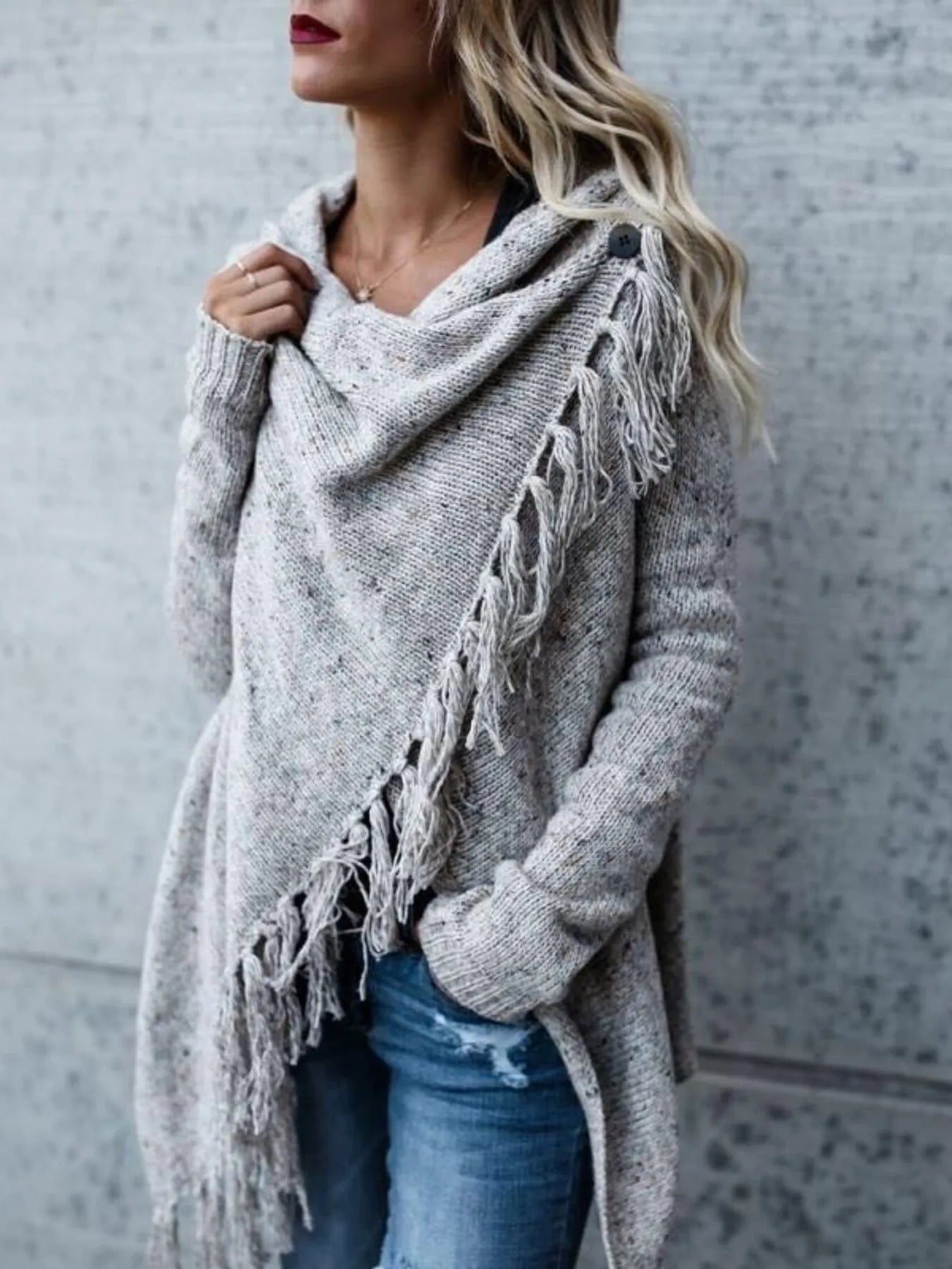 Light gray wrap cardigan with long sleeves and asymmetrical fringe trim
