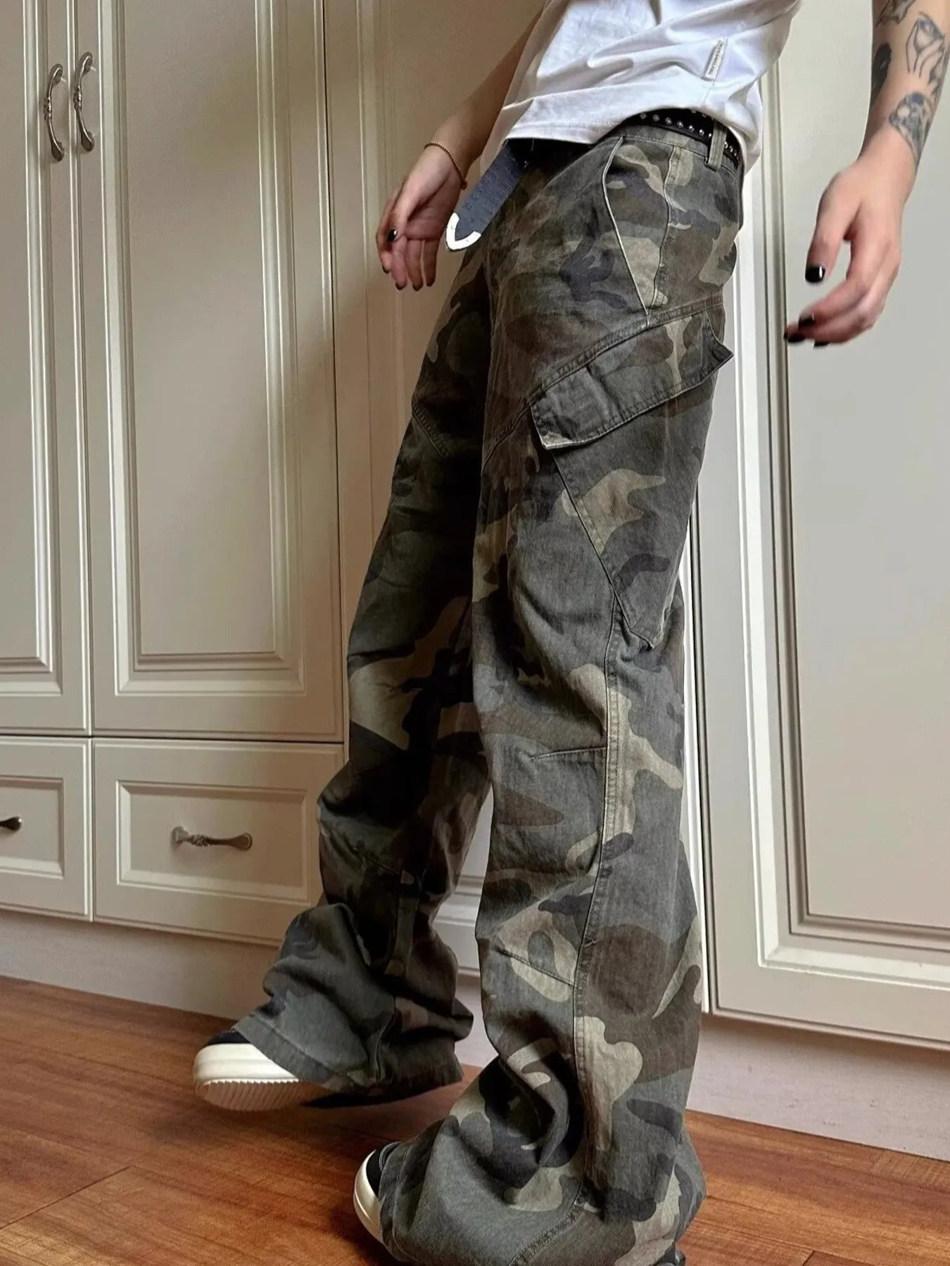 Green camouflage cargo jeans with cargo pockets, side view