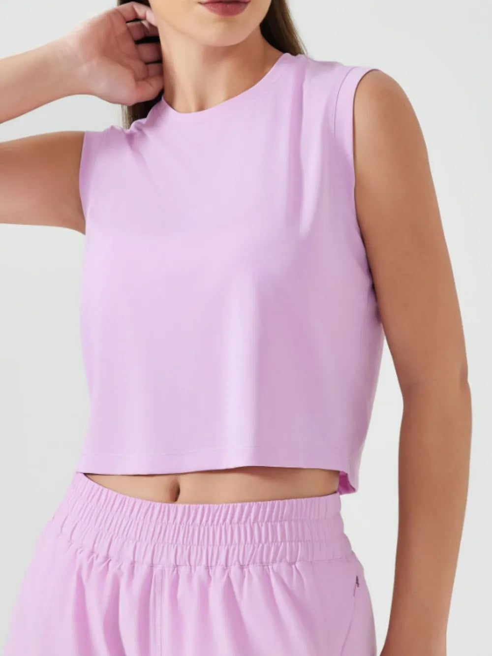 Lavender round-neck sleeveless cropped active tank with clean shoulder seams