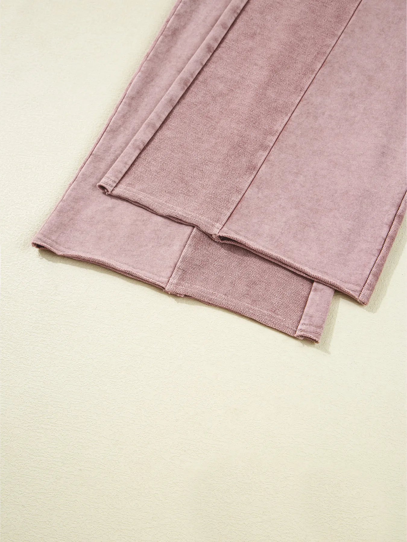 Dusty pink tiered wide-leg pants with straight wide hems and layered panel seam