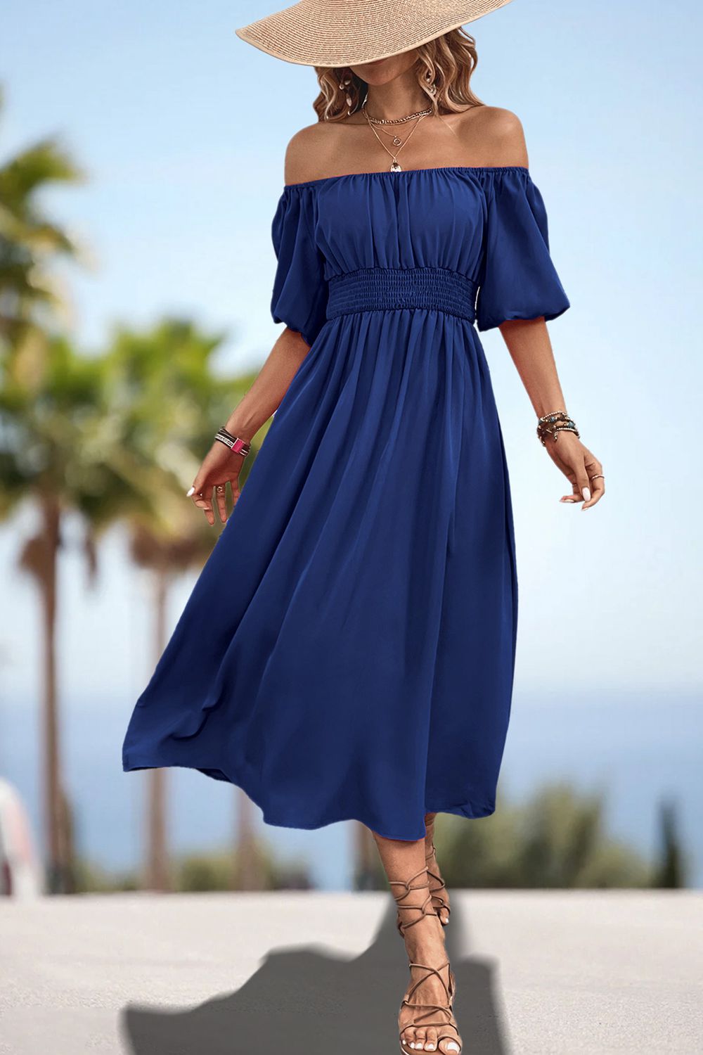 Dark blue smocked waist midi dress with puff sleeves and gathered bodice