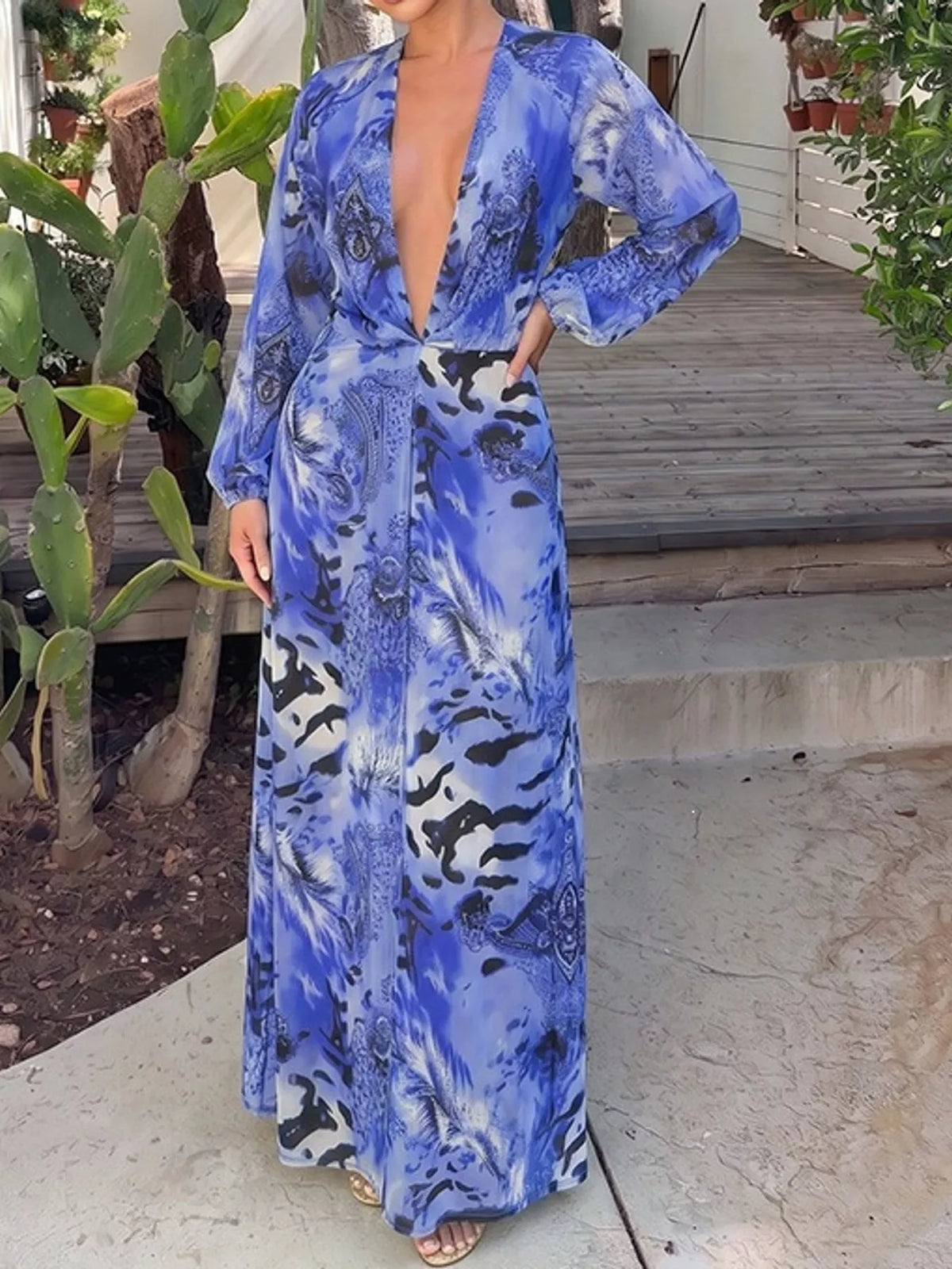 Blue printed maxi dress with deep V-neck and long sleeves, side slit