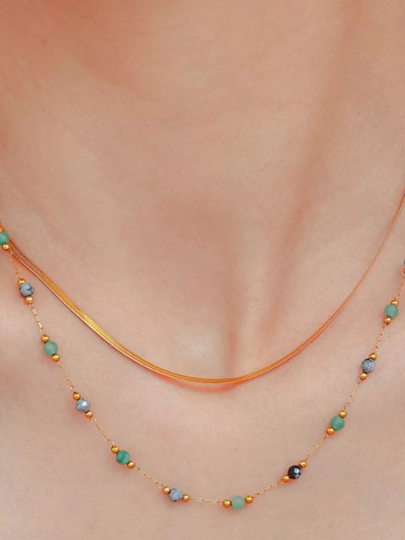 Gold chain double-strand necklace with multicolor bead drops along the neckline