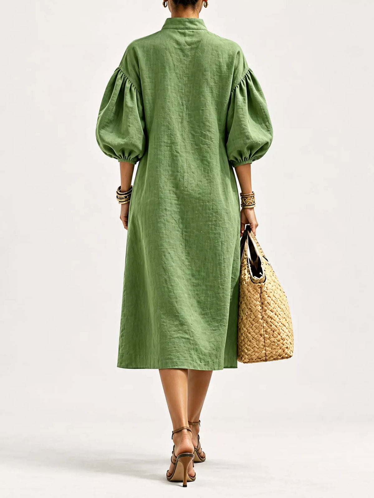 Army green midi dress back view with half-zip and voluminous puff sleeves with cuffs