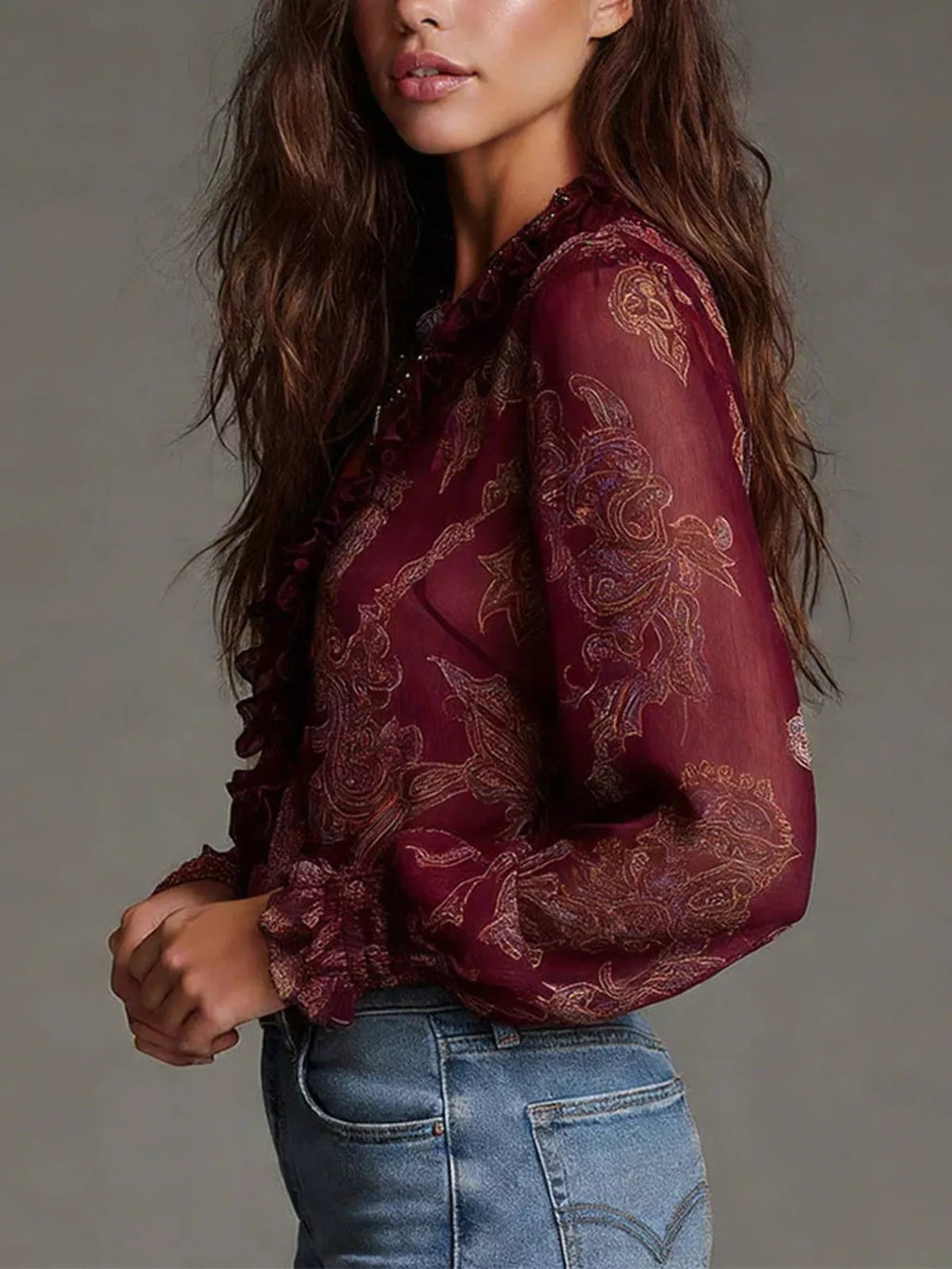 Crimson paisley ruffle zip-front blouse with long sheer sleeves and ruffle trim