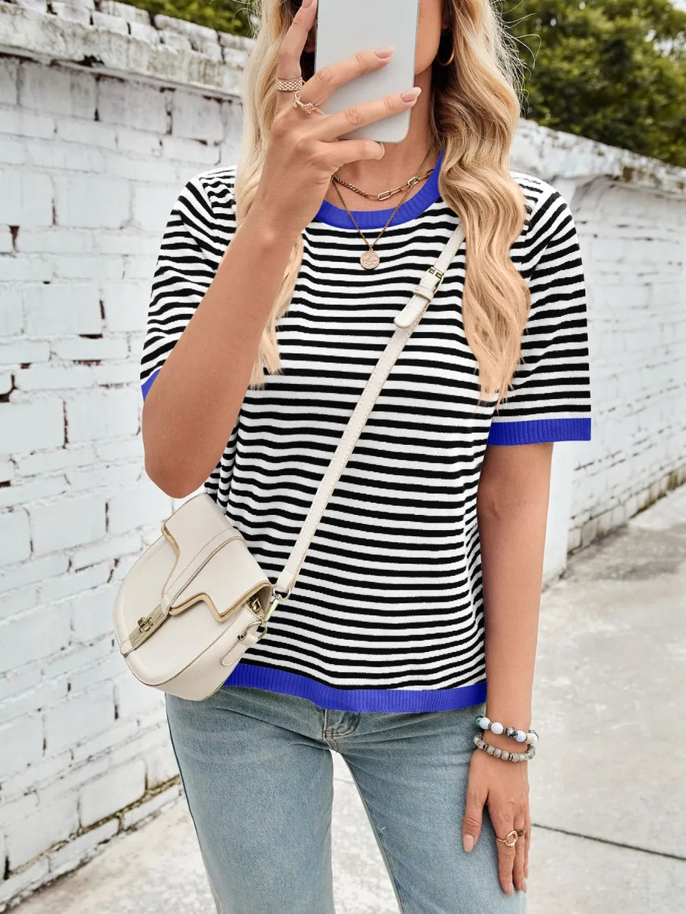 Striped knit top, black-and-white horizontal stripes with blue ribbed crew neck and hem