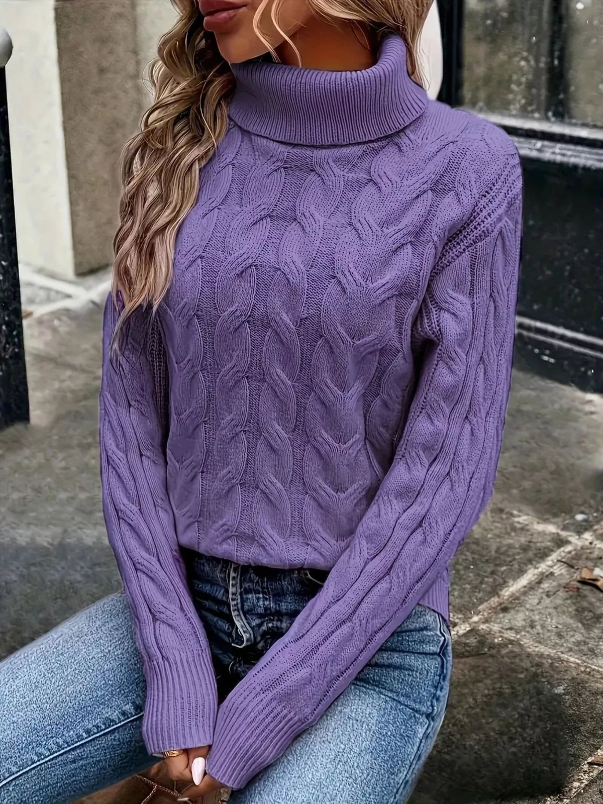 Purple cable knit turtleneck sweater with long sleeves and raised cable design