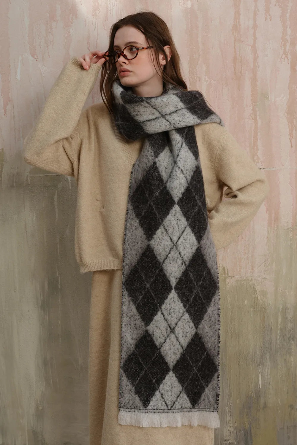 Dark argyle polyester scarf with fringed ends, gray diamonds with lighter border.