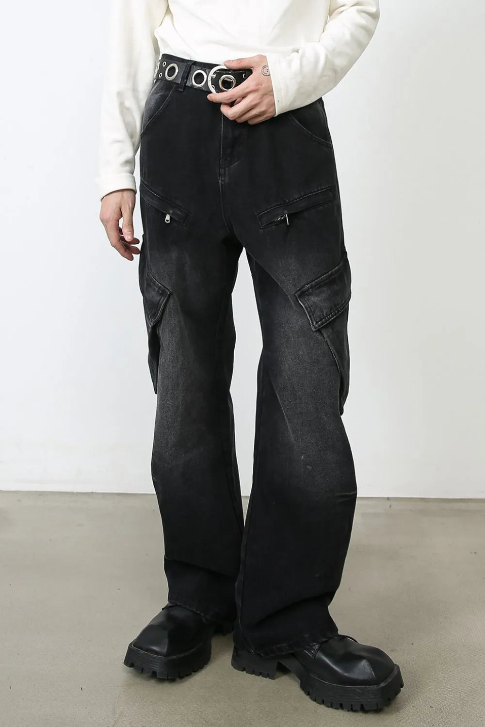 Dark baggy cargo jeans with side cargo pockets and wide straight legs