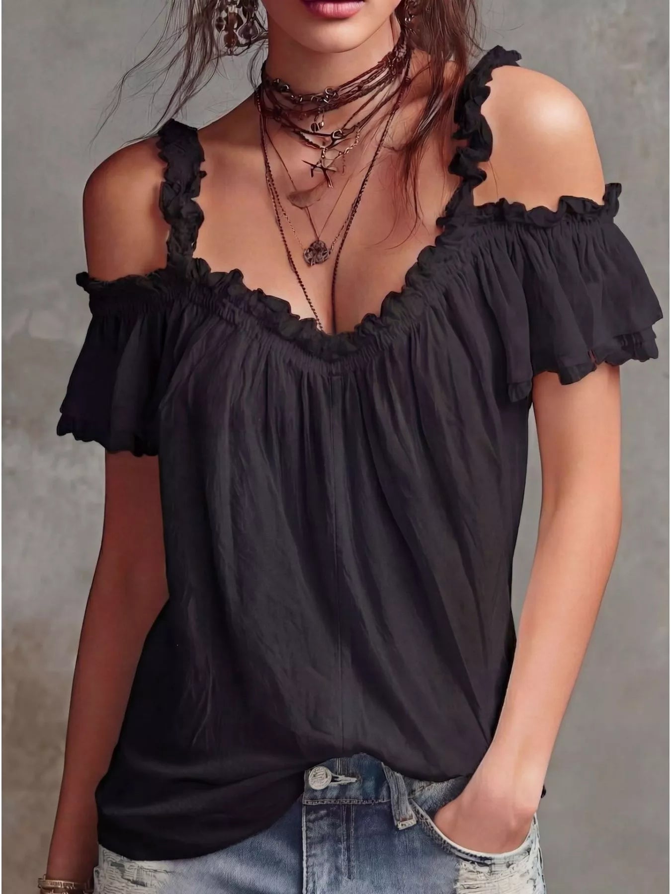 Black cold-shoulder blouse with ruffled off-shoulder neckline