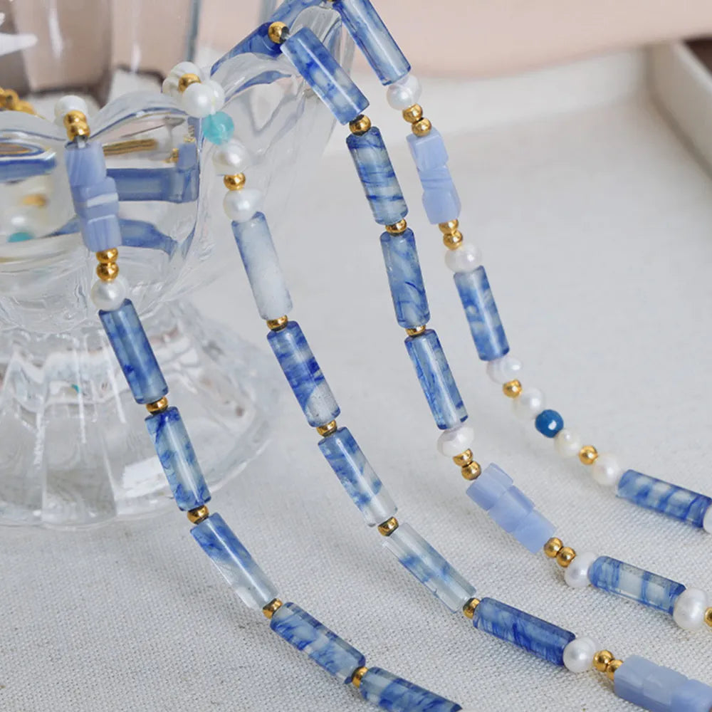 Blue rectangular bead necklace with freshwater pearls and gold-tone spacer beads