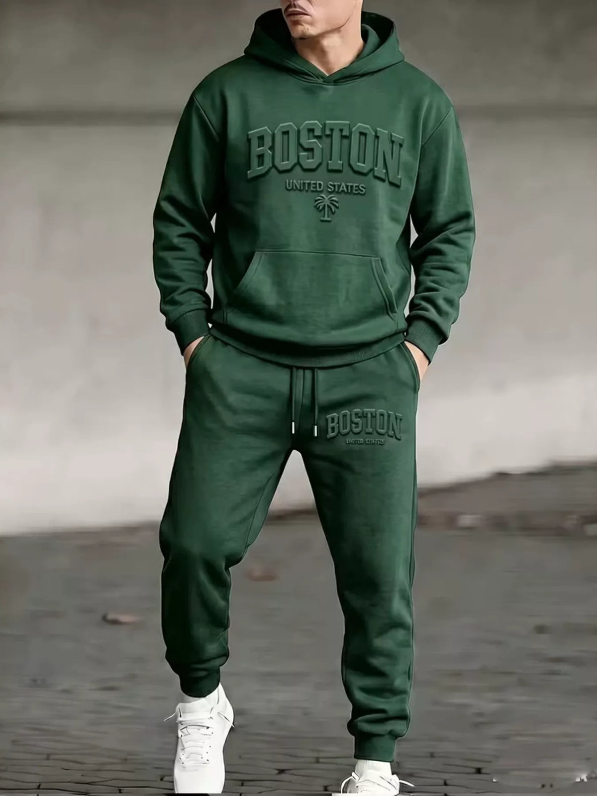 Men's two-piece hoodie and jogger set in dark green, with hood, front pocket, and cuffs